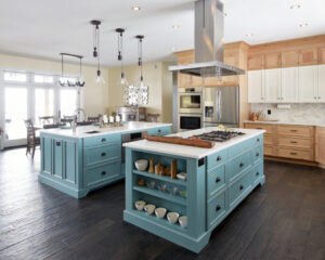 Kitchen with blue center island by Deslaurier